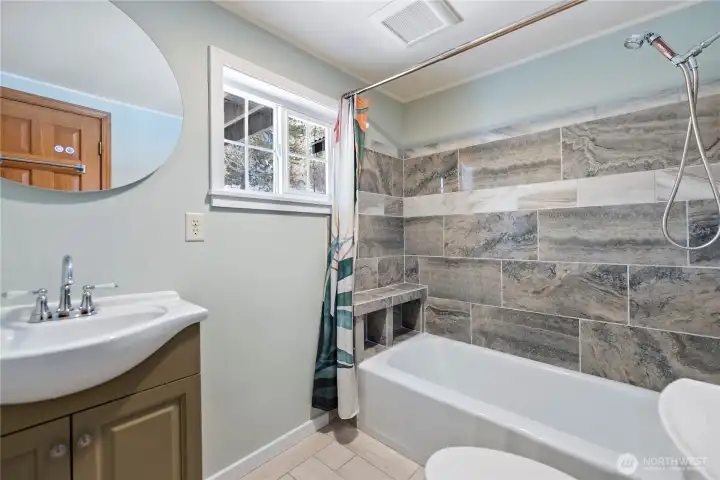 Window looks out to backyard