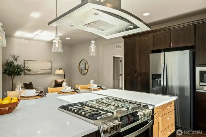 Light streams into this kitchen as you don't have a home right next door!  Statement glass pendant lighting.