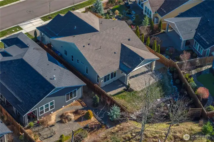 Oversized, private West facing backyard. Expanded hardscape and a motorized retractable awning.