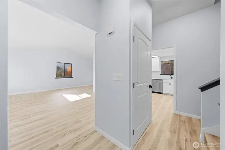 Welcome home, to the left is a spacious living room and forward to the kitchen.