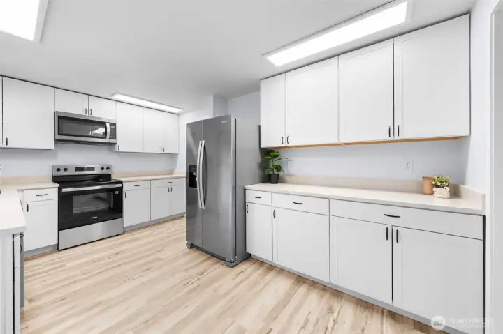 Completely updated kitchen with expanded counter space and new stainless steel appliances.