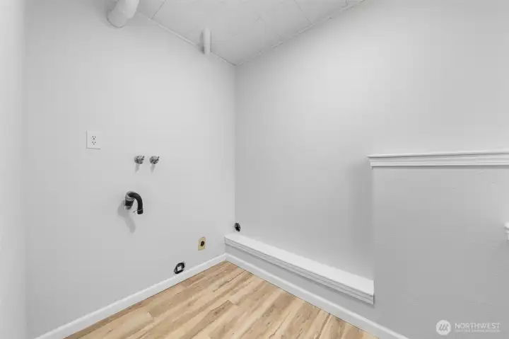 Laundry room in the day light basement.  We have working washer and dryer in the garage if you choose to keep them.