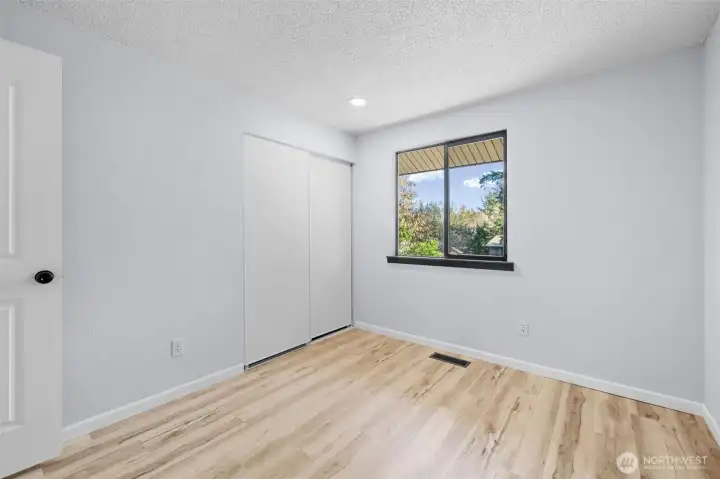 Looking at the home from the outside the window on the left above the garage.