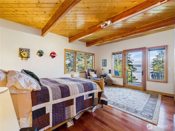 Primary bedroom that see water views from breakfast in bed