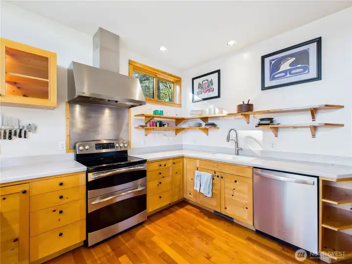 Kitchen has it all. Corian countertops with integrated kitchen sink. You're on public water so no worries about hard water.