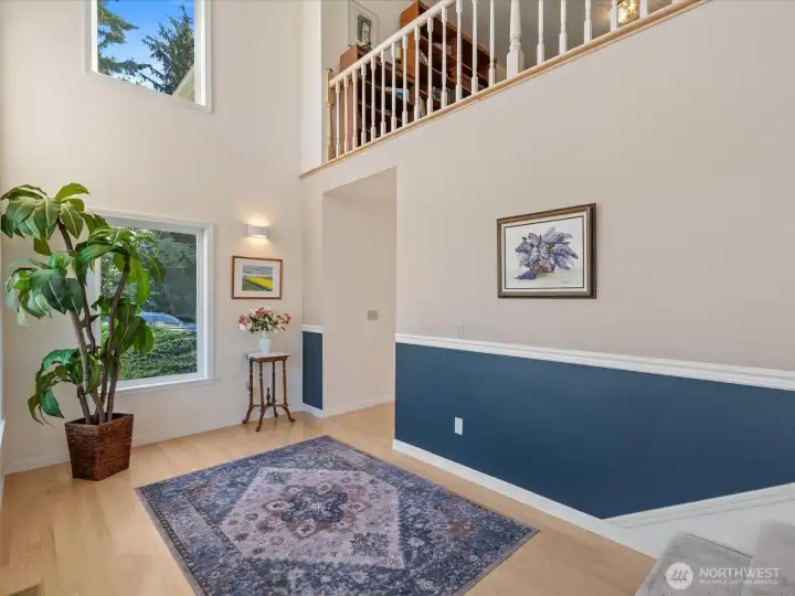 Gleaming hardwood Entry with soaring ceiling & walls of glass - leads to Living Room