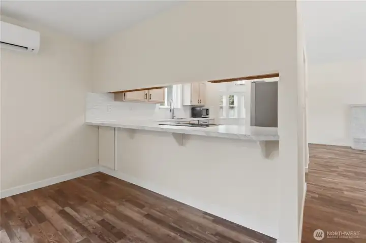 Open kitchen bar seats 4 comfortably....Excellent for entertaining.