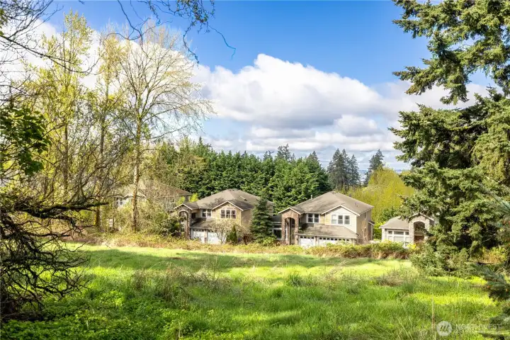 Views from the bluff looking Westerly and capturing a peek a boo view of the water.