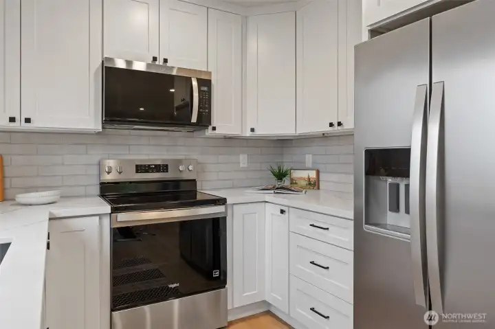 Photos for reference only. Similar features/floorplan. Kitchen has quartz countertops and tile backsplash.