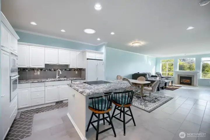 Kitchen with eating space and plenty of cupboard and countertops.
