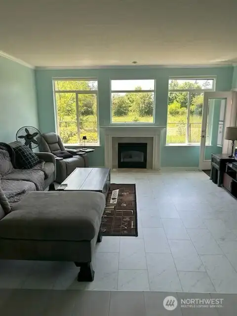 The living room is right off the kitchen and formal dining room.