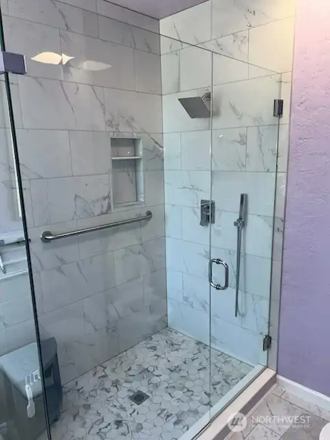 Beautiful new shower in the primary bathroom.