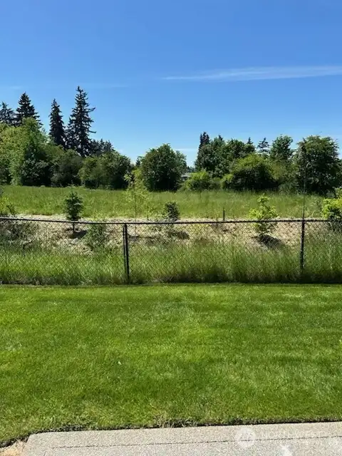 Anamazing view from kitchen, dining, living room and one of the two primary bedrooms & the patio. Greenbelt in back. I could look at this all day long.
