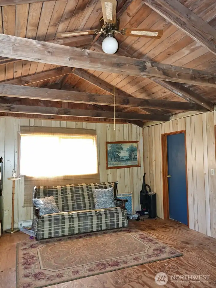 Enter into this Bonus Room w/ vaulted classic wood ceilings.