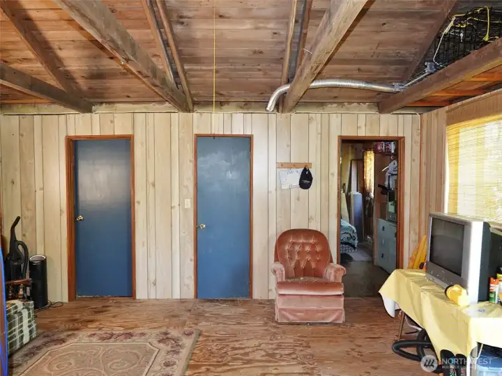 Bonus Room.  The door in the middle leads into the bathroom.  The doors on the left and right lead into the bedrooms.