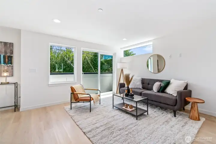 Cozy Living Area with Oversized Windows and Balcony Cozy Living Area with Oversized Windows and Balcony