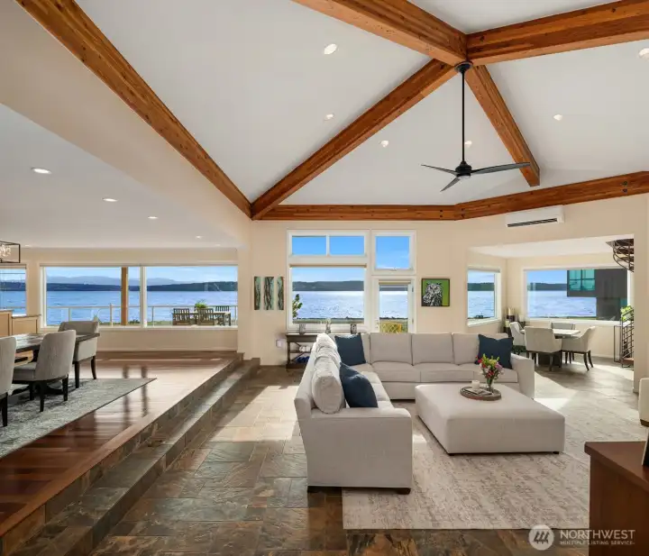 Inside, walls of windows span the living spaces, capturing breathtaking water views and front-row sightings of passing yachts and marine life.