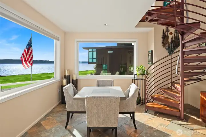 The staircase leads to a serene Zen room on the third level, where commanding captain’s views provide a breathtaking vantage point over the water and surrounding islands.