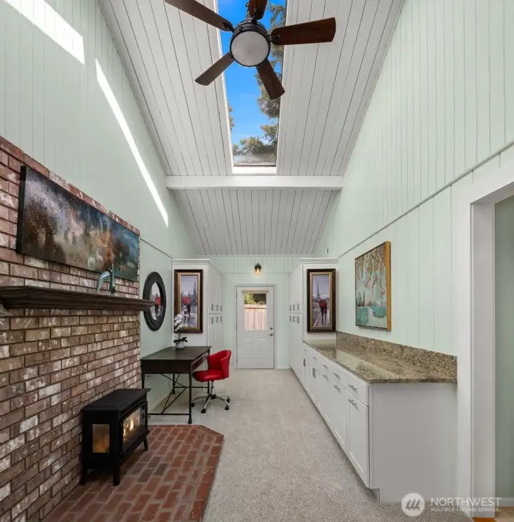 Spoil yourself with a dedicated craft room featuring abundant storage, a cozy gas fireplace, and the perfect space to create, relax, and pursue your favorite hobbies.