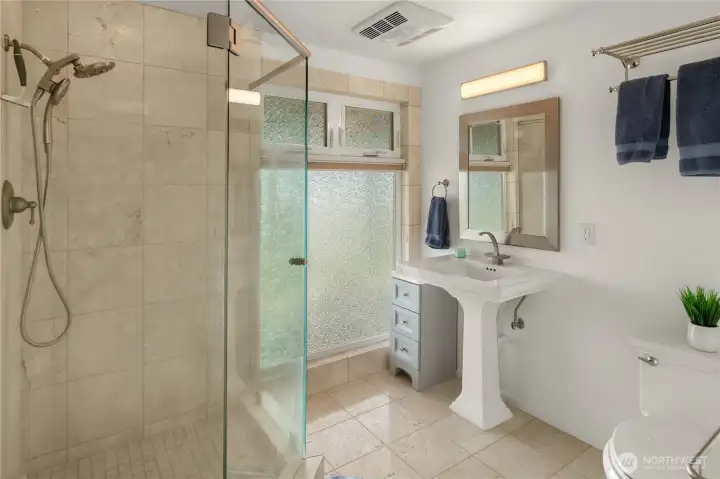With four bathrooms, each featuring a shower, the home is thoughtfully designed to accommodate guests with ease, ensuring comfort and convenience for everyone.