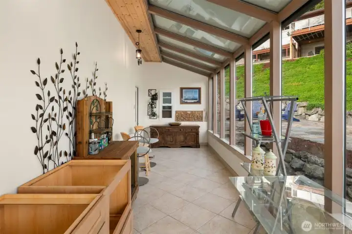 You even have your very own sunroom, the perfect space for gardening enthusiasts to nurture plants year-round while enjoying natural light and beautiful views.