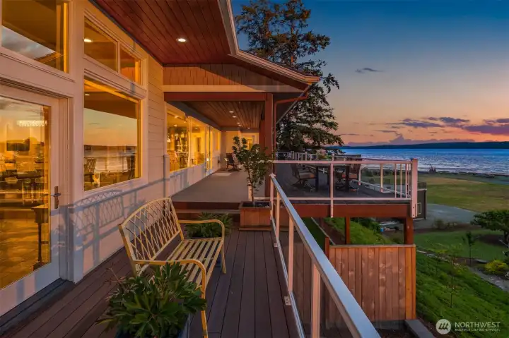 This expansive deck is designed for entertaining, offering the perfect setting for gatherings, outdoor dining, and unforgettable sunsets over the water.