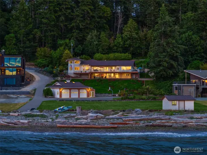 Your own private waterfront estate on one acre with 150 feet of shoreline is an exceptionally rare offering, providing a unique blend of privacy, space, and breathtaking waterfront living.