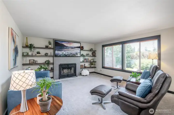Family room, light and bright, you won't need the fireplace just yet but the AC works like a charm.