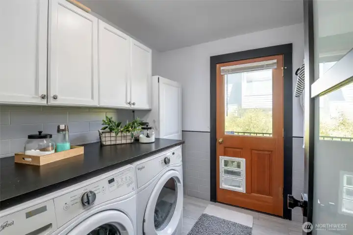 Who doesn't love a great laundry room! Door leads to exterior paved patio area.