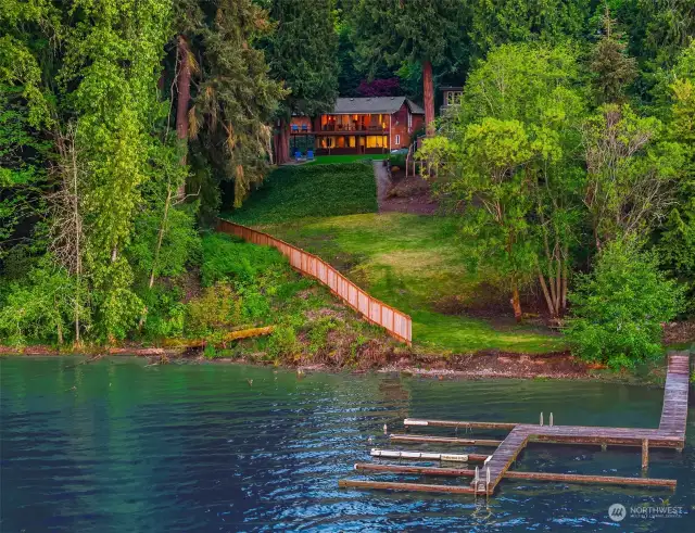 Revel in the privacy and serenity of this timeless NW lake home.