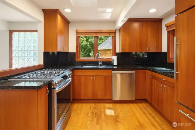 Modern kitchen with updated cabinets and appliances.