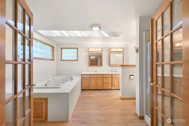 Primary bathroom. Deep jetted soaker tub, stand alone shower, double vanities and huge skylight
