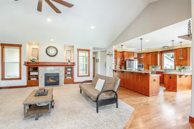 Open concept living; Family room with propane gas fireplace and spacious kitchen with eating bar and dining space