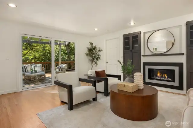 Spacious informal living room with gas fireplace