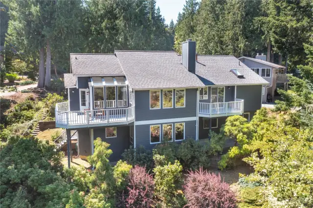 Unwind outdoors on your expansive decks with forest views and total tranquility—this backyard is pure Pacific Northwest living