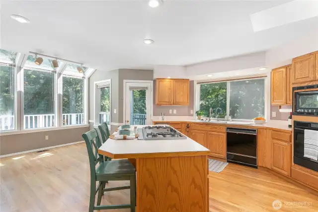 Sun-filled dining space right off the kitchen, with easy access to an expansive deck for seamless entertaining and BBQs.
