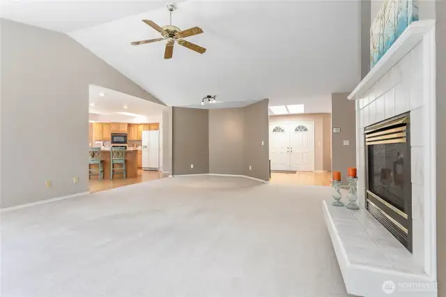 Vaulted ceilings and a spacious layout make this living room truly impressive.