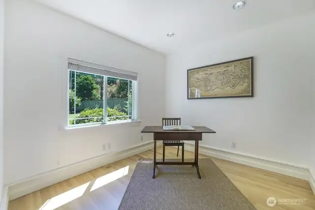 Off the additional living room is a main floor den. This den looks out to the large back yard and gets great sunlight.