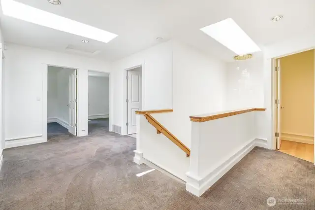 Upstairs you find 4 bedrooms, two full bathrooms, laundry room, and several skylights.