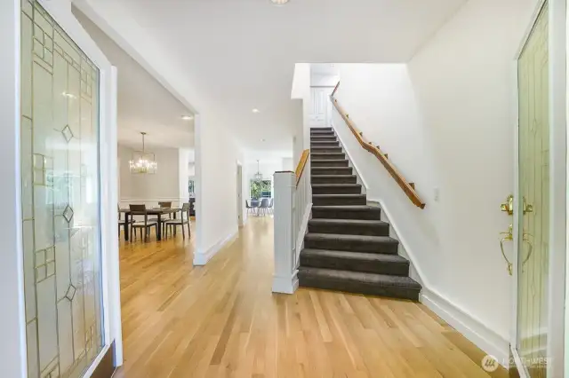 French door entry opens to refinished white oak hardwood floors and fresh interior paint.
