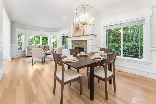 The dining room is attached to the formal living space and features updated paint and light fixture.