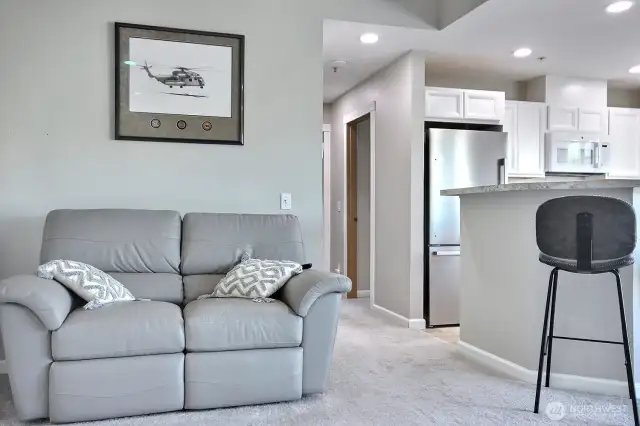 Enter ino the Open Space living room and dining area.