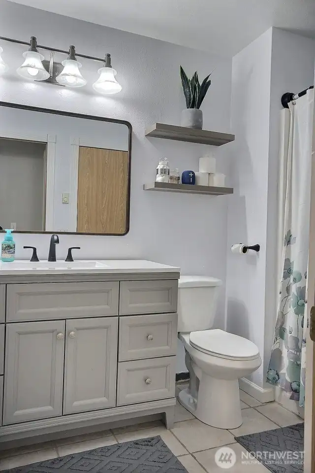The full bath with tub and shower.