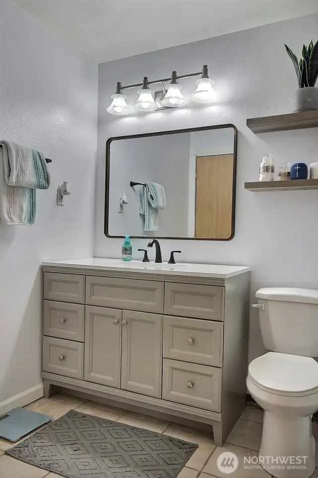 The bathroom vanity has been updated