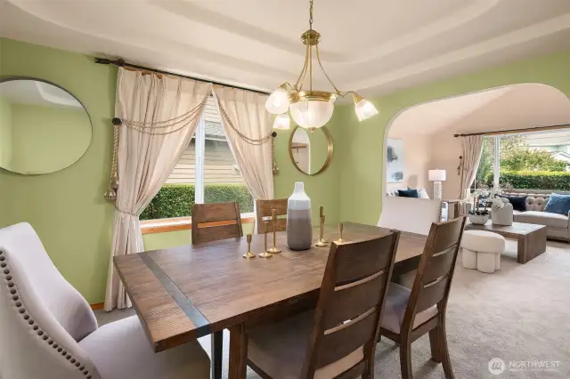 Formal Dining room offers a graceful archway & soft ambient lighting—perfect for hosting.