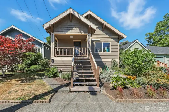 Inviting 1909 Craftsman with charming, covered front porch.