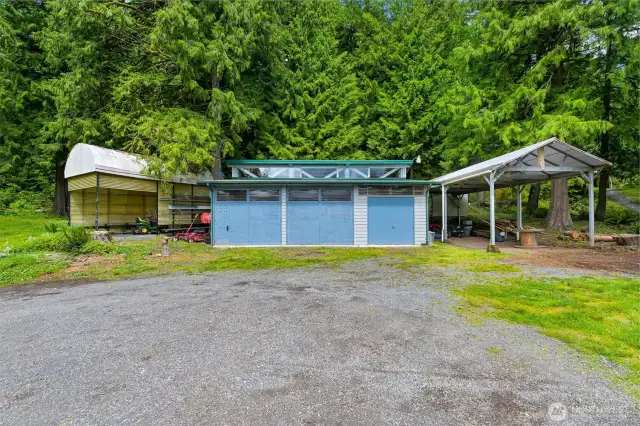 Exterior of the shop, and the covered RV parking with hookups!