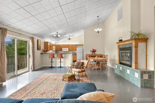 Living room into the kitchen. The celing panels are great for access, but can easily be changed.