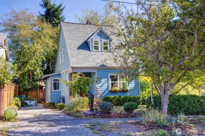 Classic Hilman City home with newer siding, exterior paint and roof.