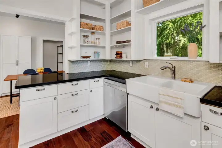 Looking toward the eating place in kitchen with additional storage.